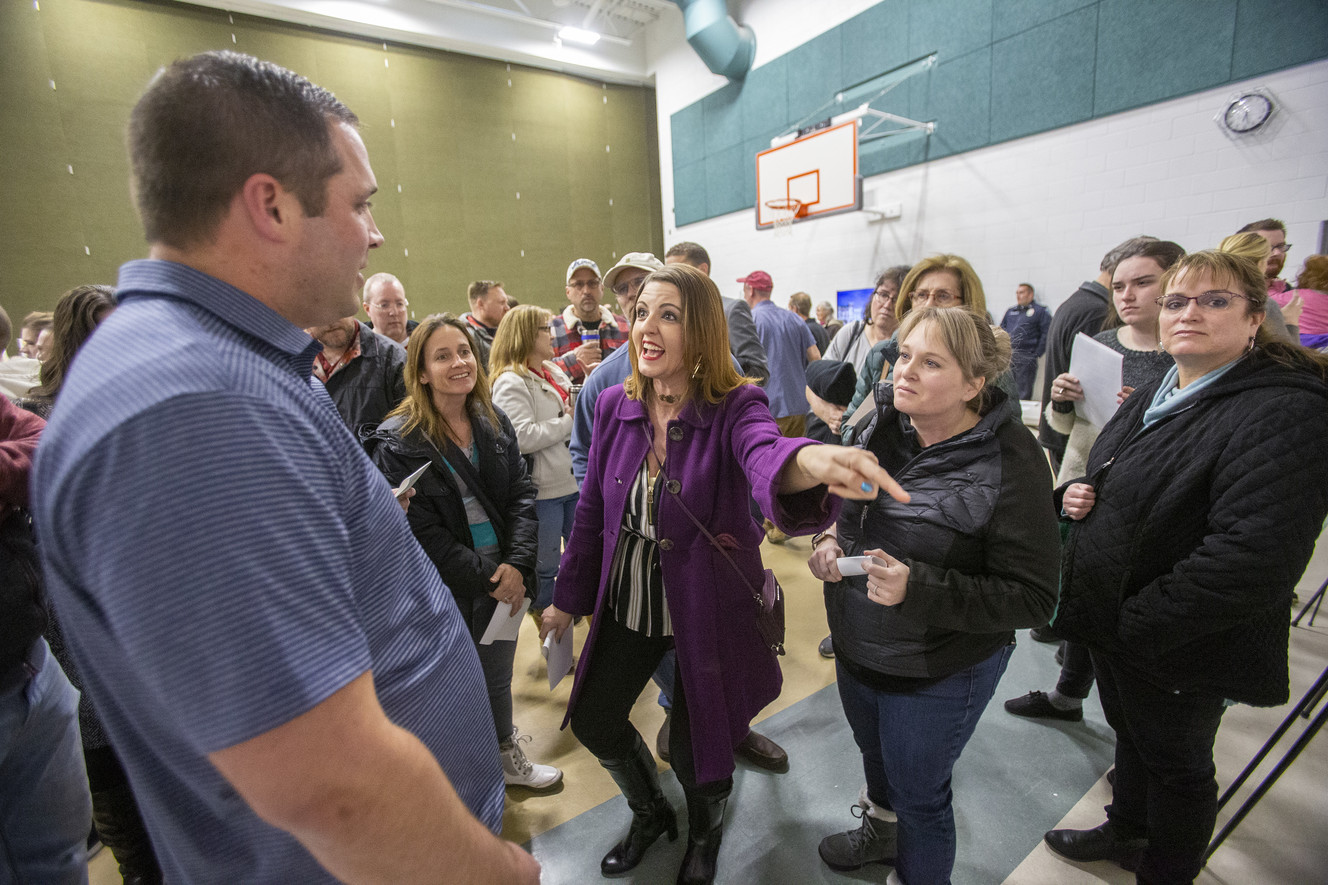Emily Johnson and others question Ryan Button of Olympia Hills as residents of Herriman and Riverton express their feelings on the proposed Olympia Hills development during a public meeting at Bastian Elementary School in Herriman on Wednesday, March 13, 2019. (Photo: Scott G Winterton, KSL)