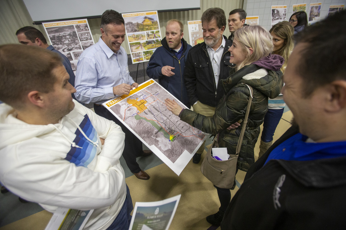 Cory Shupe of Blu Planning answers questions from residents of Herriman and Riverton on the proposed Olympia Hills development during a public meeting at Bastian Elementary School in Herriman on Wednesday, March 13, 2019. (Photo: Scott G Winterton, KSL)