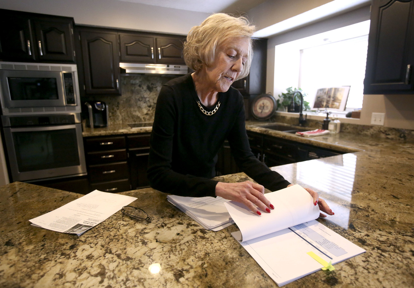Kathe Bolan, whose water is contaminated with elevated levels of lead and copper, shows the results of water tests at her home in Sandy on Thursday, March 14, 2019. (Photo: Kristin Murphy, KSL)