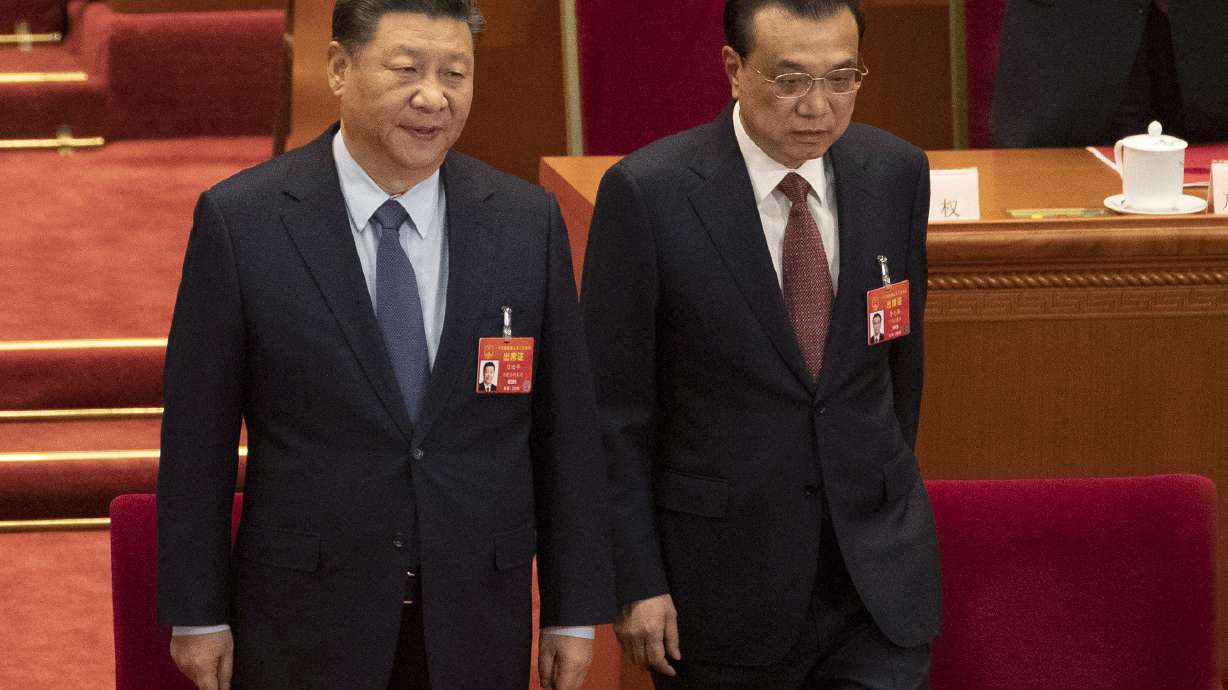 China's premier denies Beijing tells companies to spy