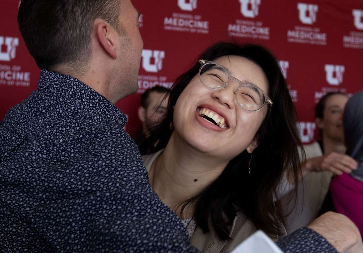 University of Utah medical school students Jorgen Madsen and Yan Yan Xiong celebrate their invitations to residency programs during Match Day at Rice Eccles Stadium in Salt Lake City on Friday, March 15, 2019. Xiong will attend the University of Pittsburgh's neurology residency program, and Madsen will attend the internal medicine/pediatrics combined residency at Cincinnati Children’s Hospital Medical Center and the University of Cincinnati Medical Center. (Photo: Laura Seitz, KSL)