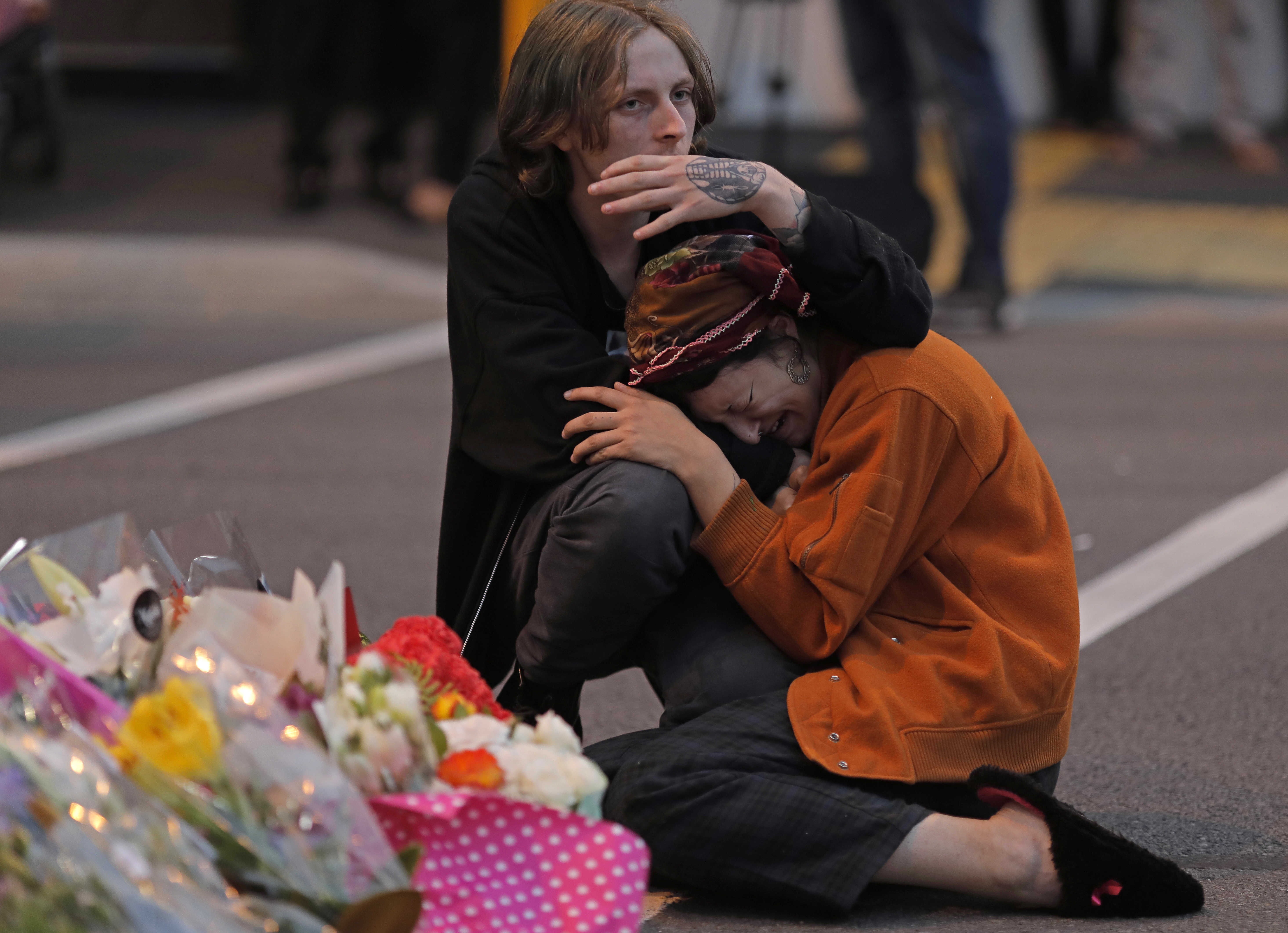 Mourners pay their respects at a makeshift memorial near the Masjid Al Noor mosque in Christchurch, New Zealand, Saturday, March 16, 2019.(AP Photo/Vincent Yu)