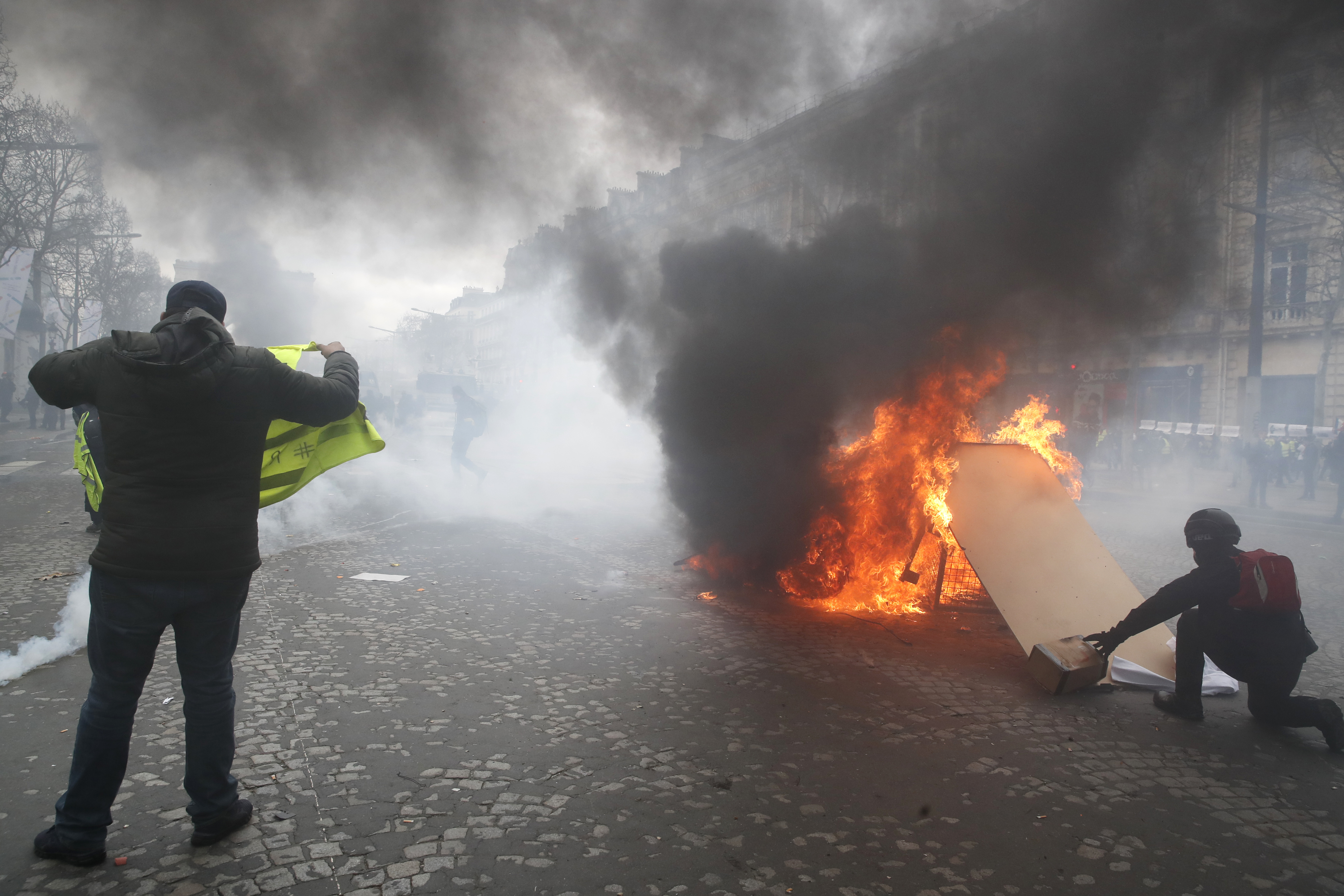 The Latest: French protesters slam Macron's 'empty words'