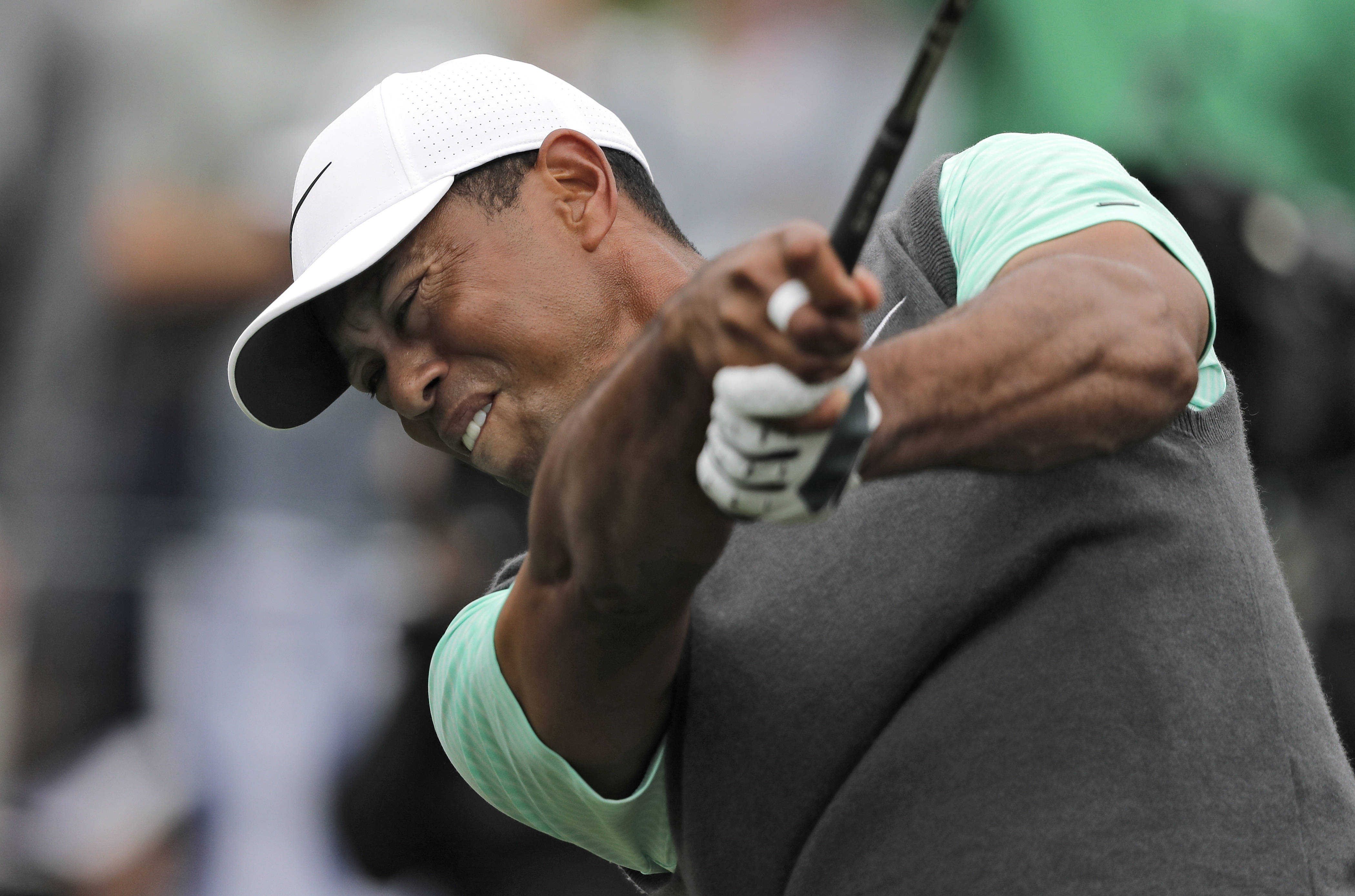 Woods lands birdie, laughs at famed 17 after quadruple-bogey