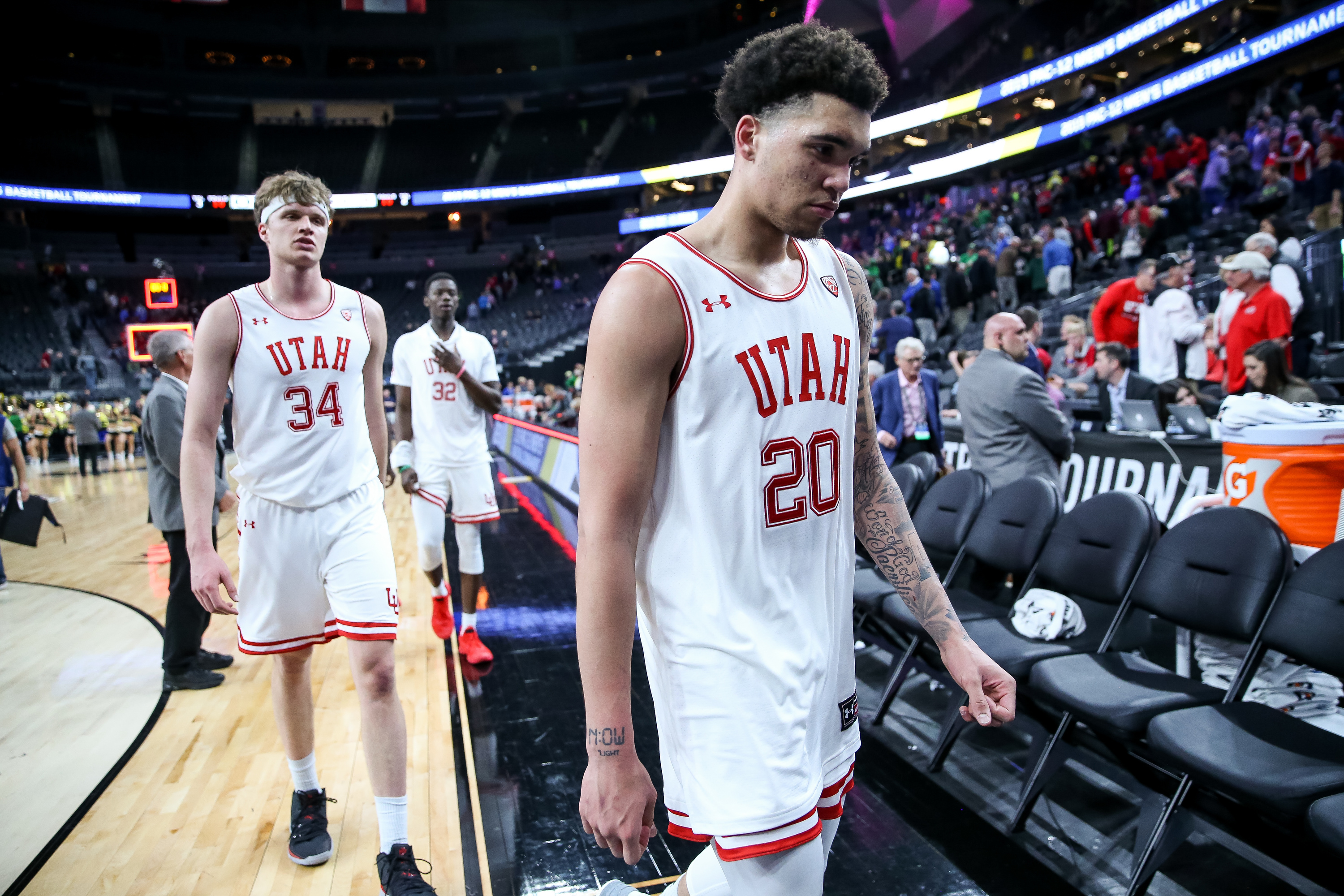 Utah Utes forward Timmy Allen (20) and teammates leave the court after their loss to the Oregon Ducks in a Pac-12 Tournament quarterfinal game at the T-Mobile Arena in Las Vegas on Thursday, March 14, 2019. (Photo: Spenser Heaps, KSL)