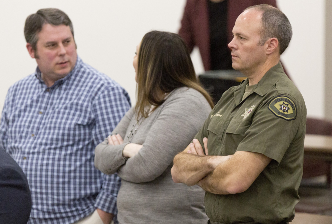 Utah County sheriff's deputy Greg Sherwood, right, stands as members of the Utah Supreme Court leave the courtroom after oral arguments in State v. Grunwald in the J. Reuben Clark Law School at Brigham Young University on Monday, March 18, 2019, in Provo. Sherwood was shot during the sequence of events that left Utah County Sheriff's Sgt. Cory Wride dead. (Photo: Evan Cobb)