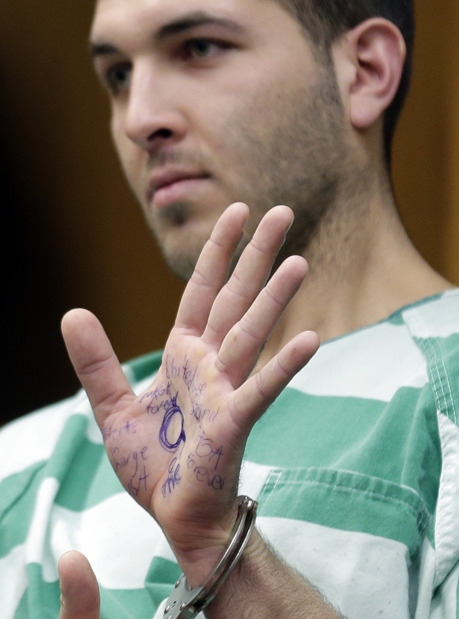 Mobster hit suspect shows symbol linked to conspiracy theory