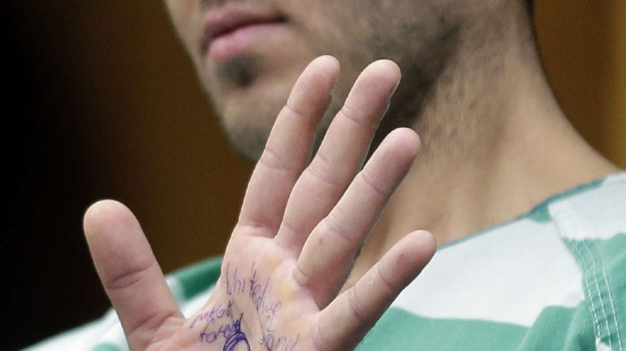Mobster hit suspect shows symbol linked to conspiracy theory