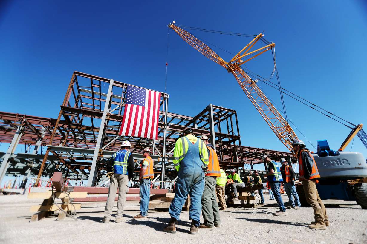 Workers on the Salt Lake City International Airport expansion project attend a topping-off ceremony in which the final beam of the north concourse was lifted into place on Tuesday, March 19, 2019. (Photo: Scott G Winterton, KSL)