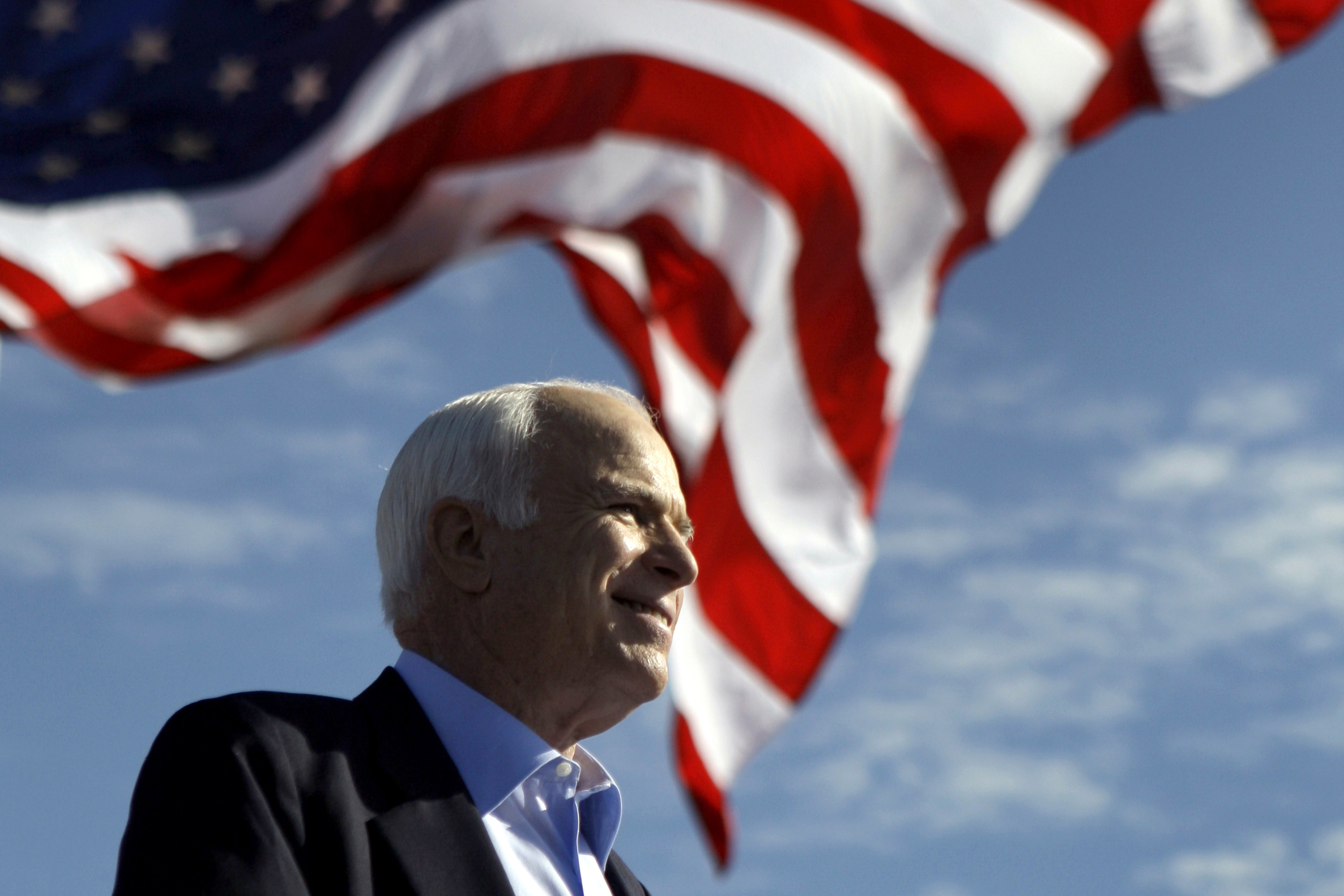 Trump aims new blasts at McCain, claims credit for funeral