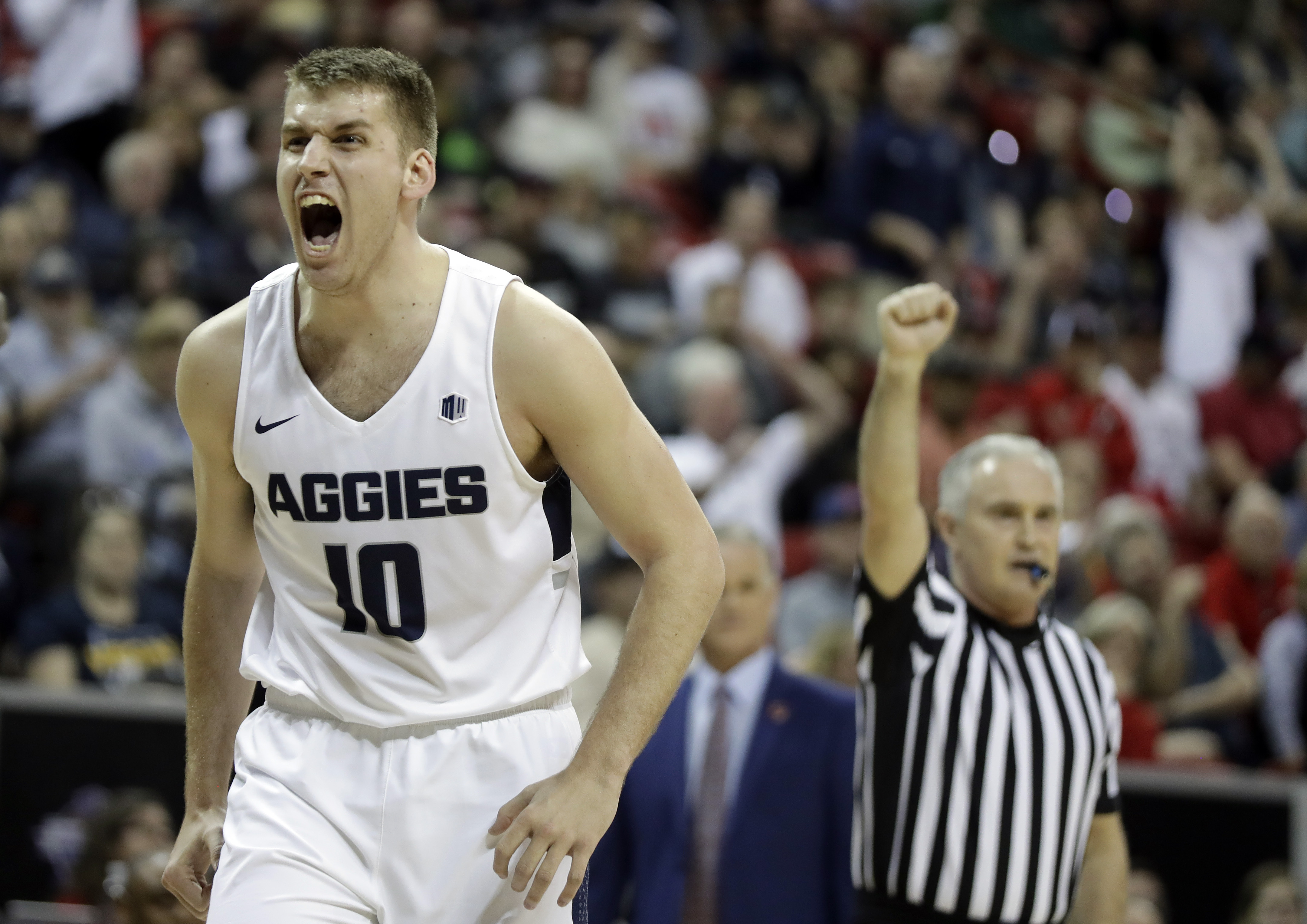 Utah State's Quinn Taylor reacts to a foul call during the first half of an NCAA college basketball game against San Diego State in the Mountain West Conference men's tournament championship Saturday, March 16, 2019, in Las Vegas. (Isaac Brekken, AP Photo)
