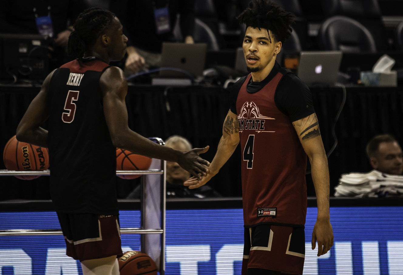 New Mexico State guard JoJo Zamora slaps hands with NMSU guard Clayton Henry during a team practice at Vivint Arena on Wednesday, March 20, 2019. Zamora played his junior year at Utah before he transferred to New Mexico State. (Photo: Carter Williams, KSL.com)