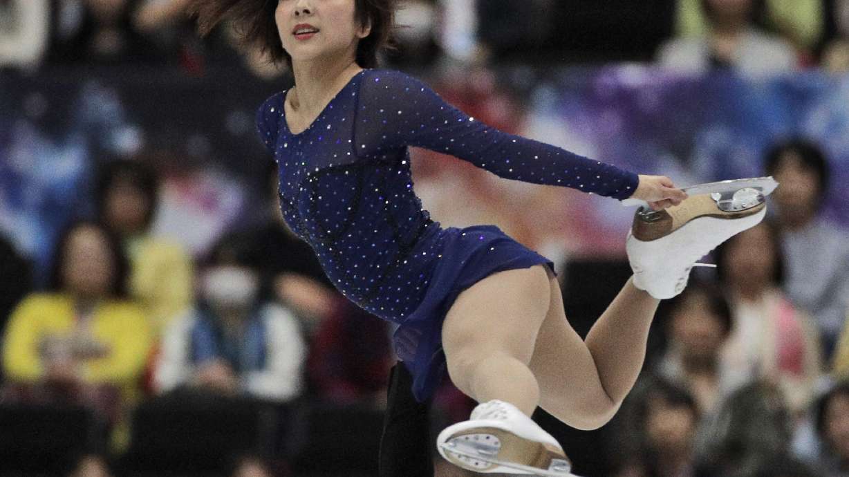 China claims gold in pairs at world figure skating
