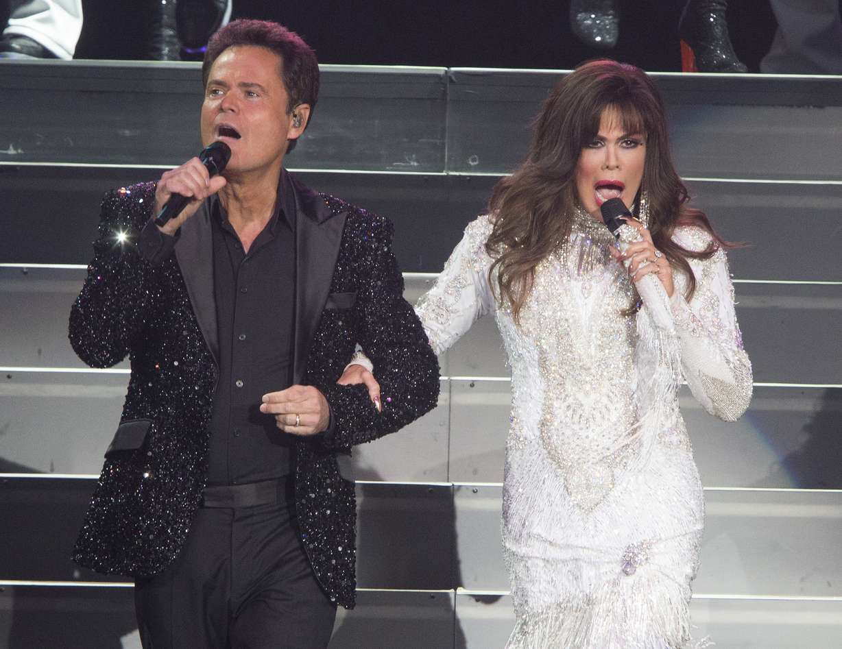 This Aug. 22, 2017 photo shows Donny Osmond, left, and Marie Osmond performing at the Santander Arena in Reading, Pa.