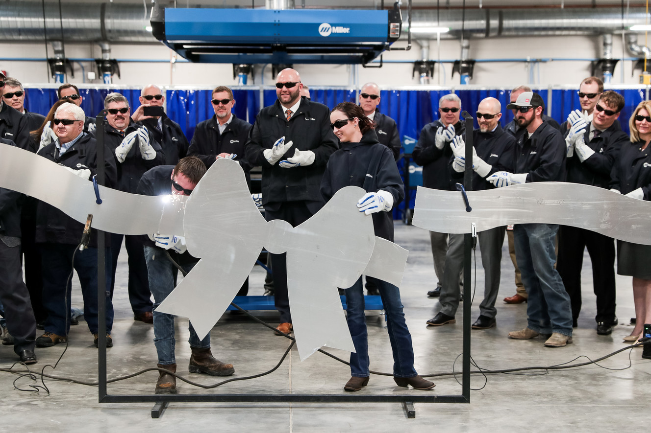 Christopher Nolden and Lyciera Williams, both 18 and students at Uintah Basin Technical College in Roosevelt, use torches to cut a metal ribbon at the opening of the school's new Welding Technology Building on Thursday, March 21, 2019. (Photo: Spenser Heaps, KSL)