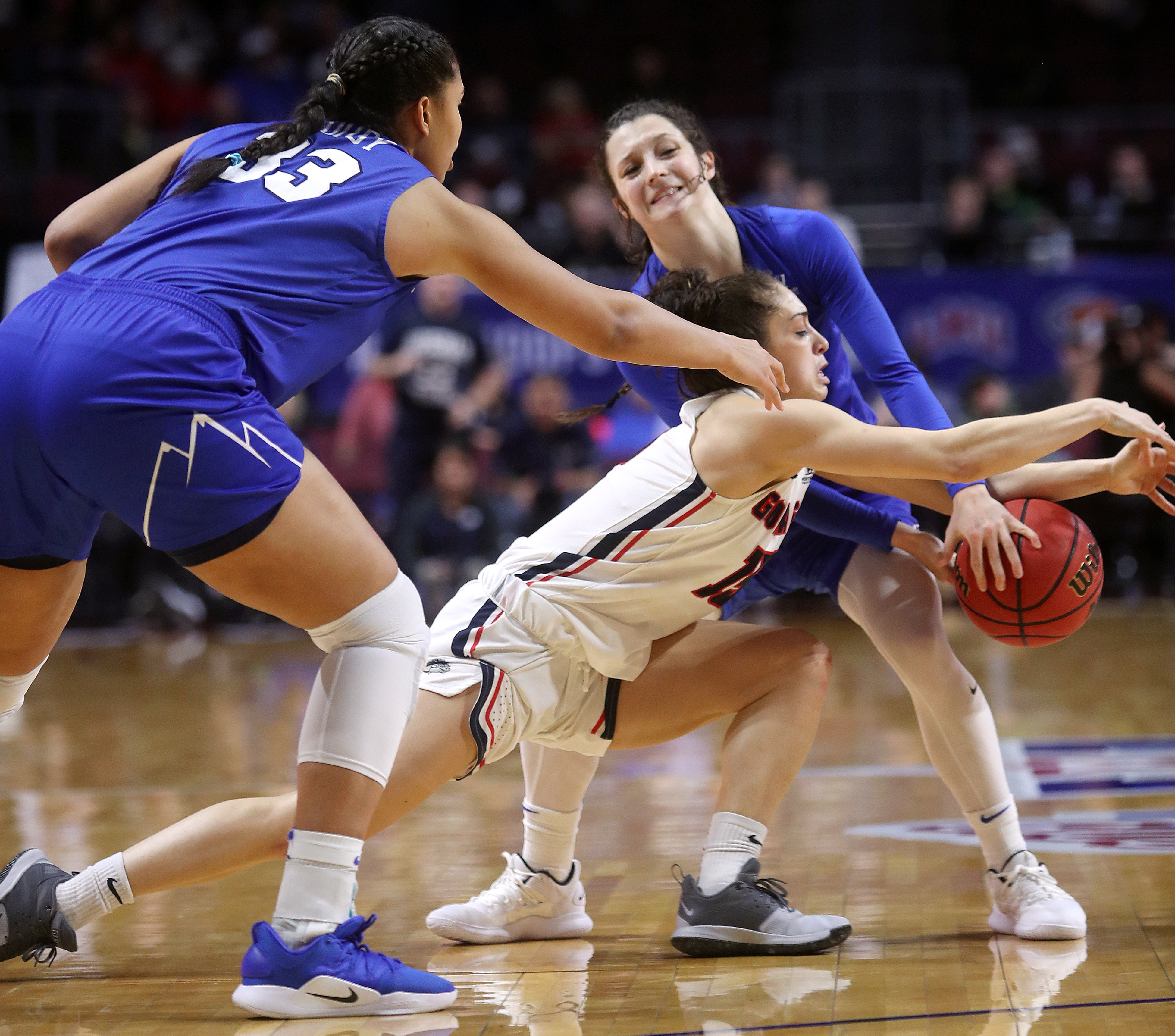 BYU Cougars forward Jasmine Moody (33) and BYU Cougars guard Brenna Chase (1) defend Gonzaga Bulldogs guard Jessie Loera (15) as BYU and Gonzaga women play for the WCC tournament championship at the Orleans Arena in Las Vegas on Tuesday, March 12, 2019. BYU wins the West Coast Tournament 82-68 over Gonzaga. (Photo: Scott G Winterton, KSL)