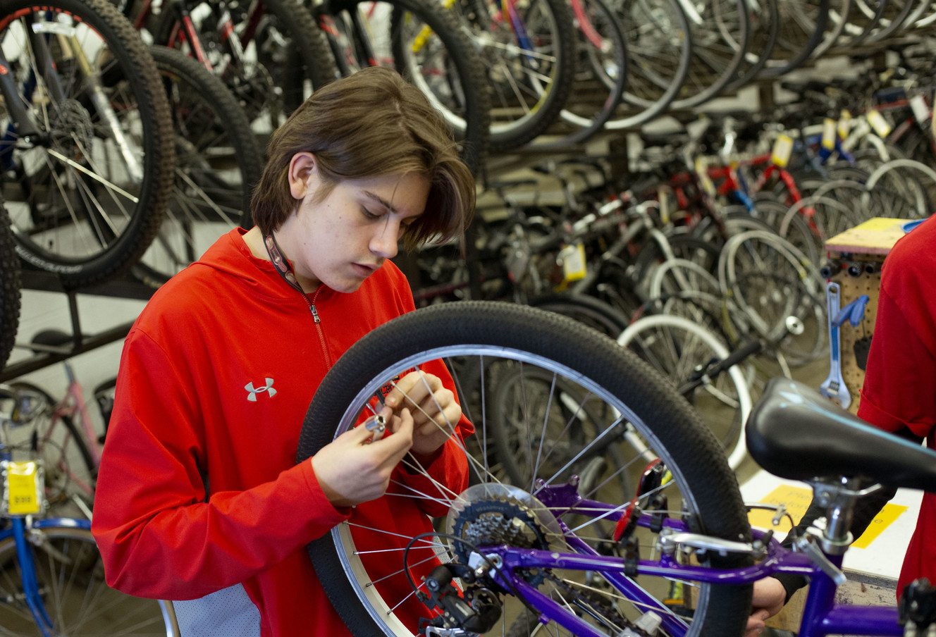 Students bring refurbished bikes to refugee children