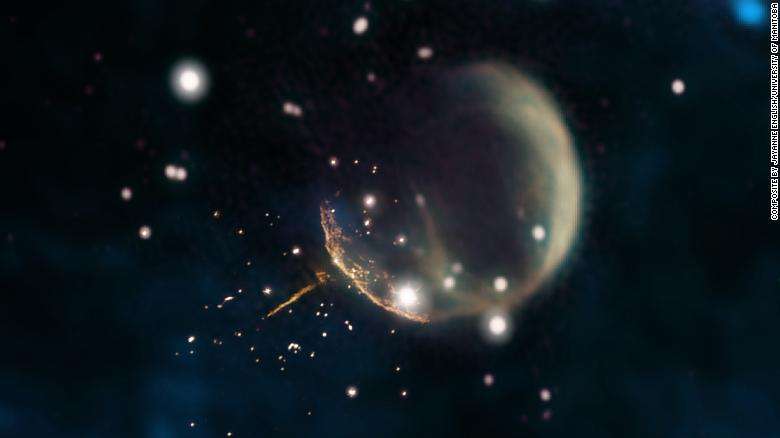 The CTB 1 supernova remnant resembles a ghostly bubble and the glowing trail is the pulsar; Photo from CNN