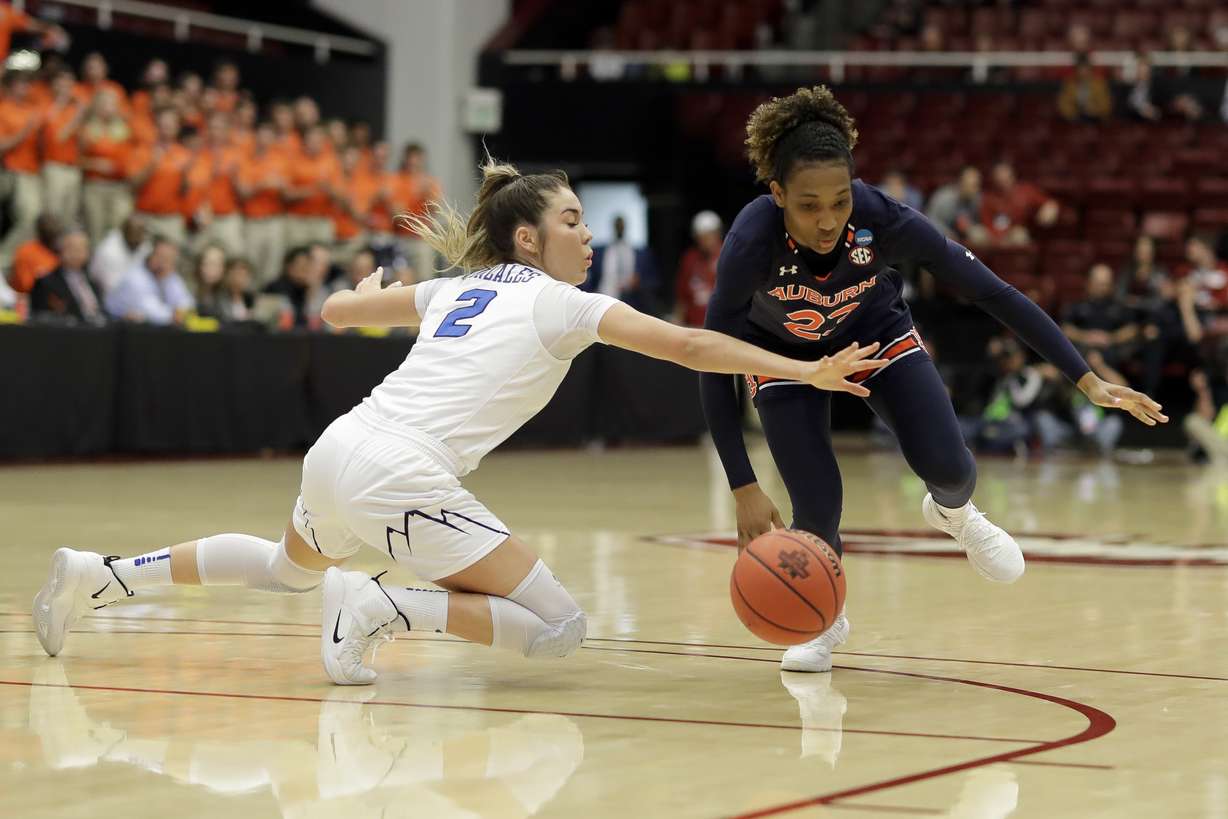 BYU guard Shaylee Gonzales, left, and Auburn guard Crystal Primm dive for a loose ball during the first half of a first-round game in the NCAA women's college basketball tournament in Stanford, Calif., Saturday, March 23, 2019. (Photo: Chris Carlson, AP)