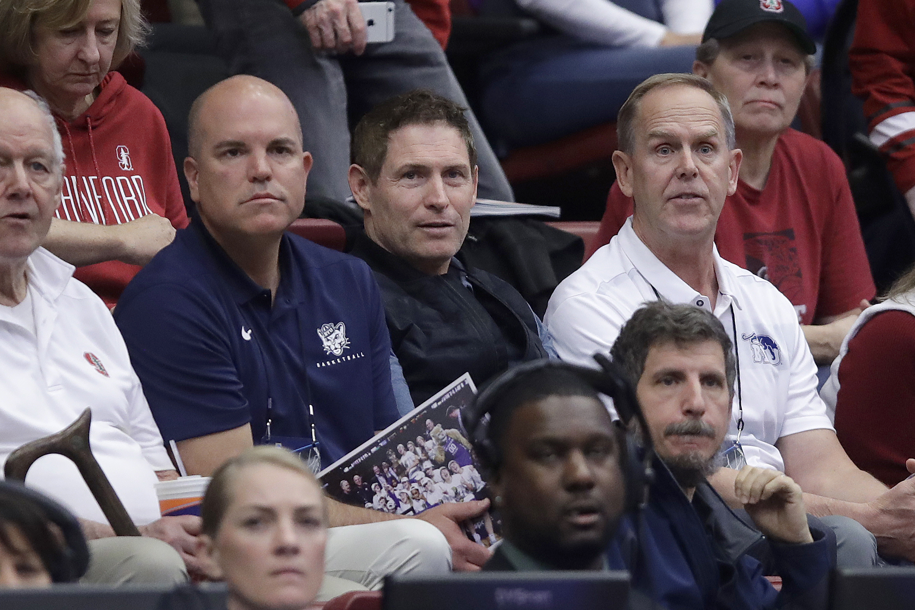 Former NFL quarterback Steve Young, center, watches during the second half of a first-round game in the NCAA women's college basketball tournament between BYU and Auburn in Stanford, Calif., Saturday, March 23, 2019. (Photo: Jeff Chiu, AP)