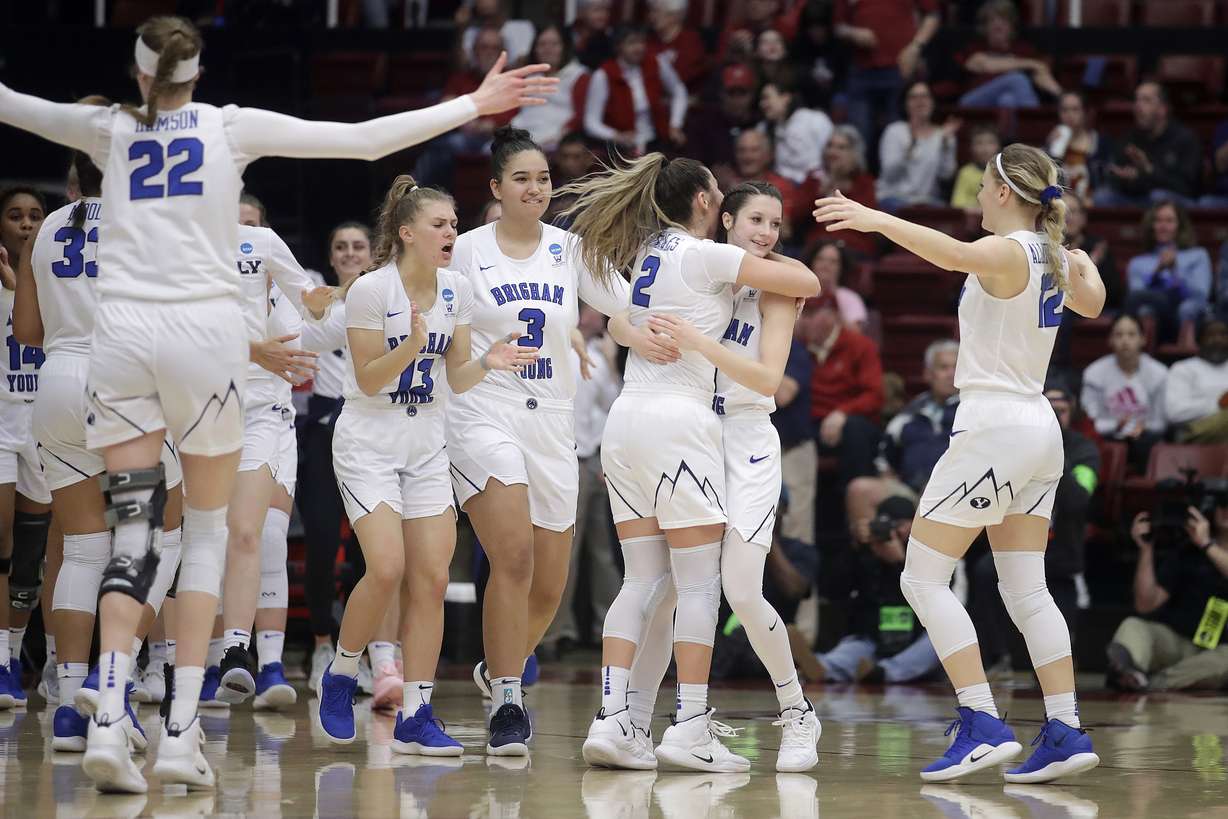 BYU players celebrate after defeating Auburn in a first-round game in the NCAA women's college basketball tournament in Stanford, Calif., Saturday, March 23, 2019. (Photo: Jeff Chiu, AP)