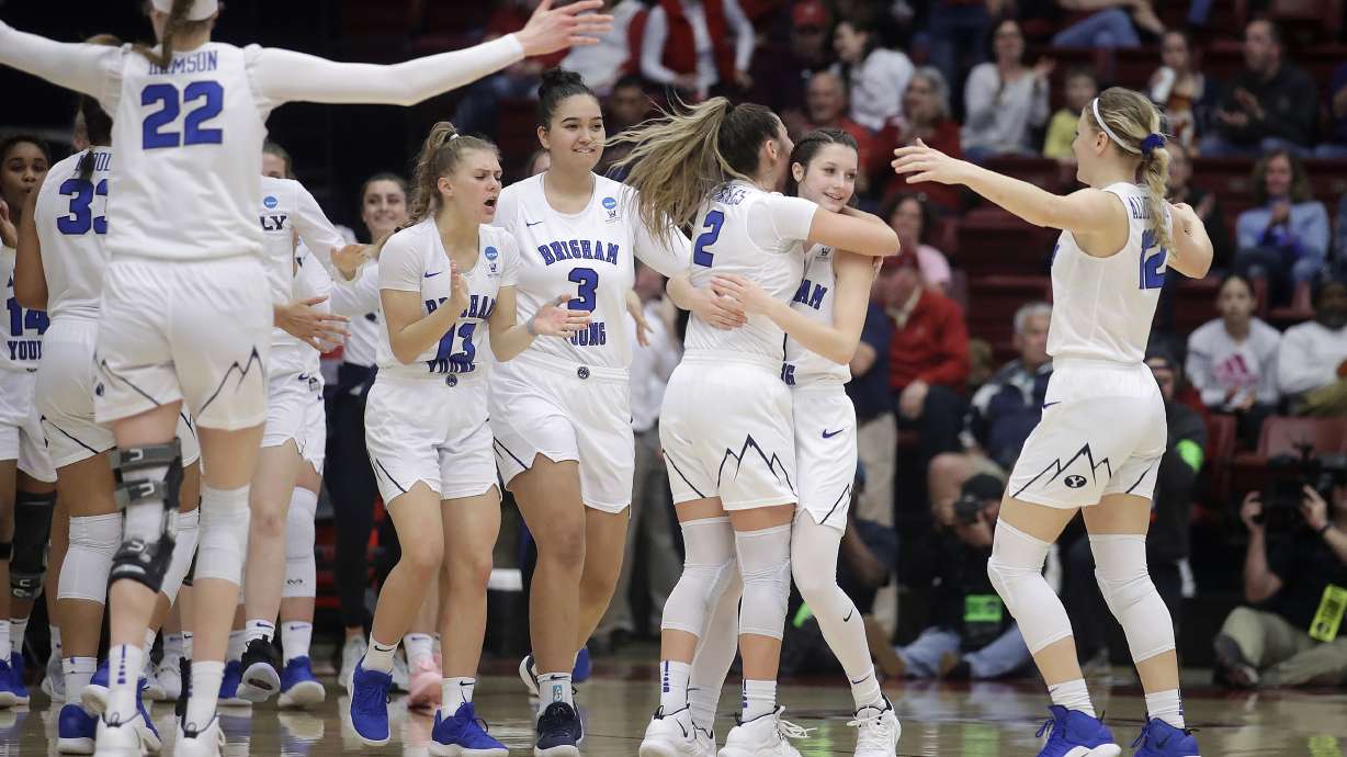 BYU players celebrate after defeating Auburn in a first-round game in the NCAA women's college basketball tournament in Stanford, Calif., Saturday, March 23, 2019. (AP Photo/Jeff Chiu)