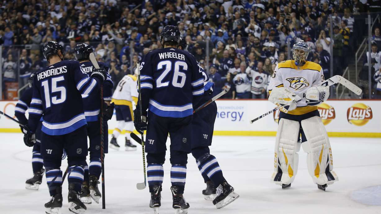 Connor's hat trick helps Jets top Preds, clinch playoff spot