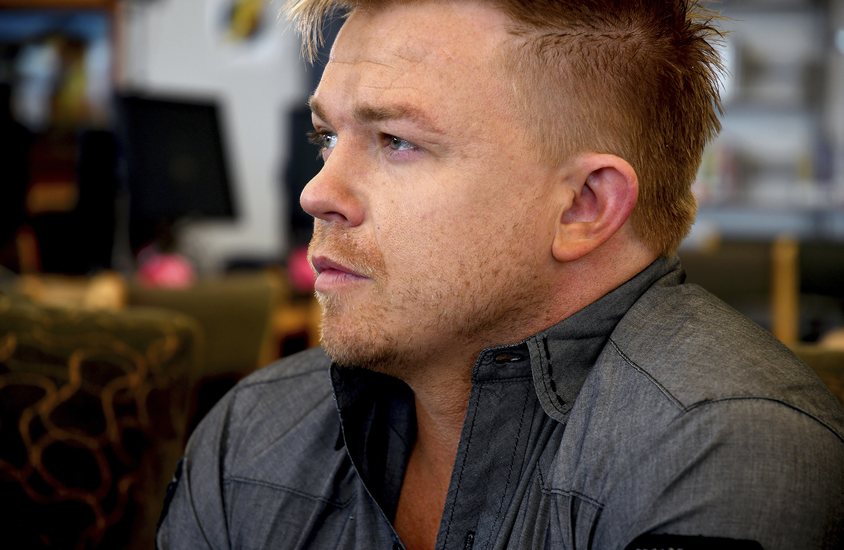 In this Saturday, March 23, 2019 photo, former student Craig Scott reflects about the upcoming 20th anniversary of the mass shooting at Columbine High School in suburban Denver. (AP Photo/Thomas Peipert)