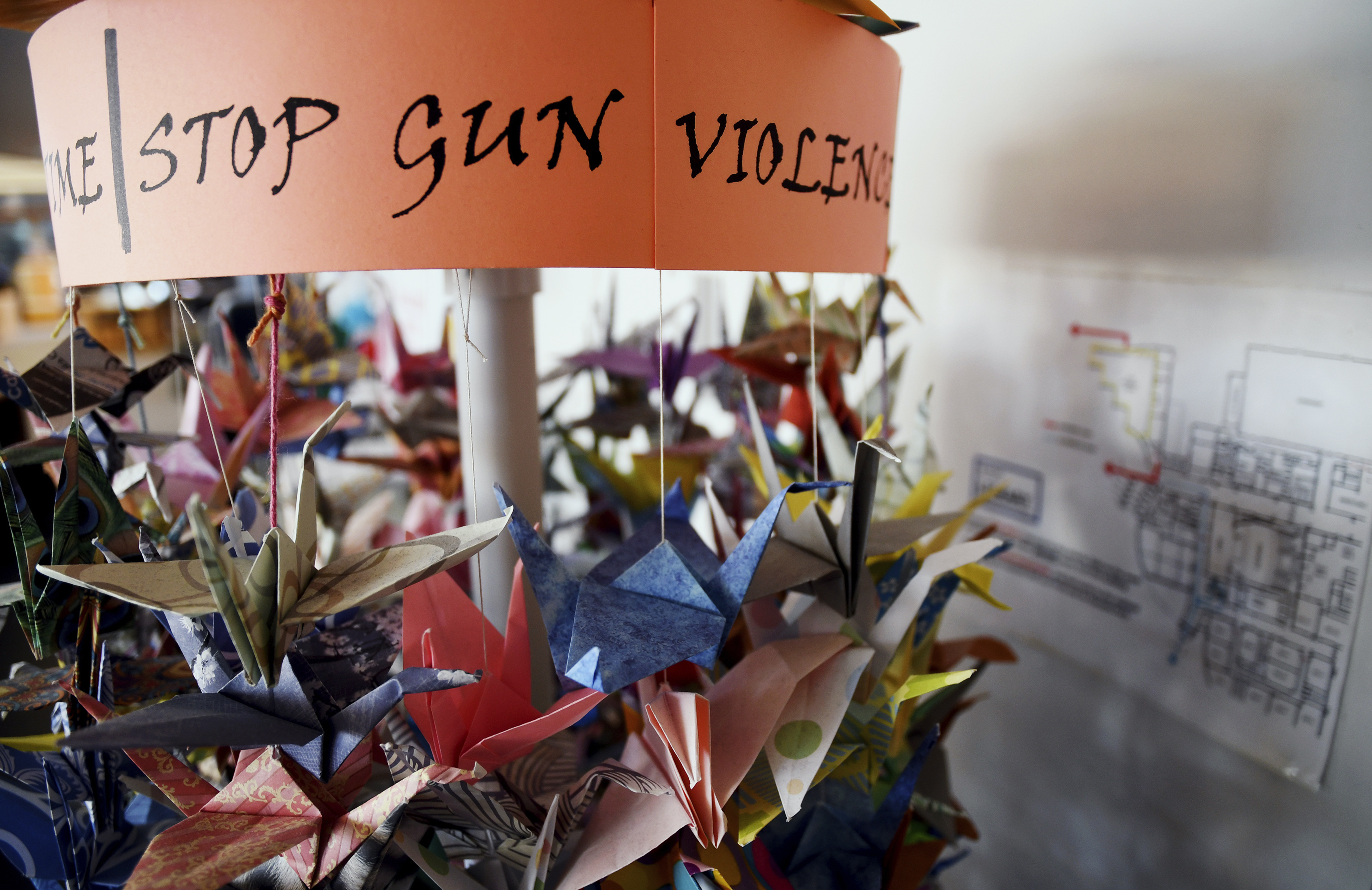 Paper cranes hang in the Columbine High School library in suburban Denver on Saturday, March 23, 2019. (AP Photo/Thomas Peipert)