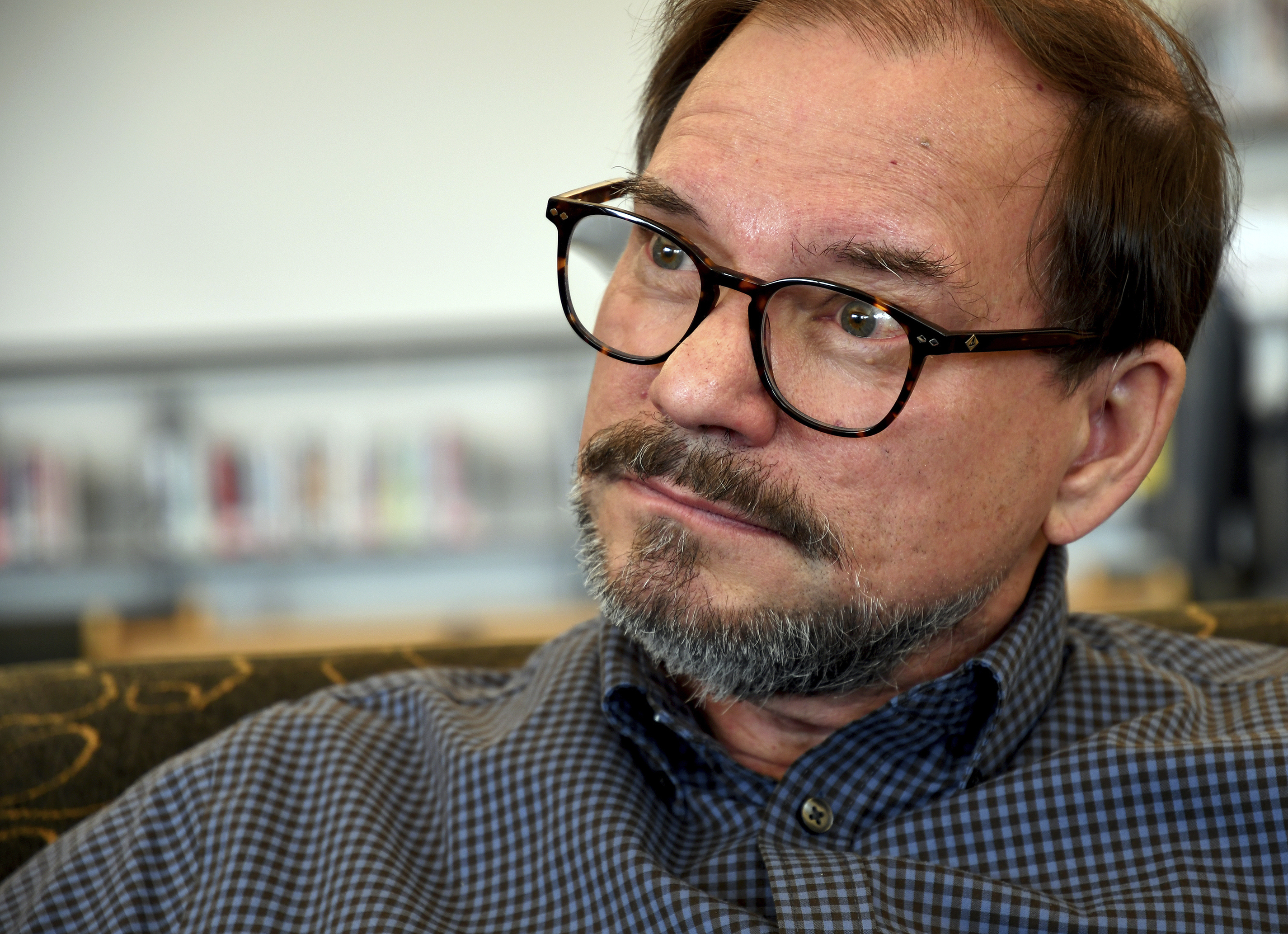 In this Saturday, March 23, 2019 photo, Tom Mauser is interviewed about the upcoming 20th anniversary of the mass shooting at Columbine High School in suburban Denver. (AP Photo/Thomas Peipert)