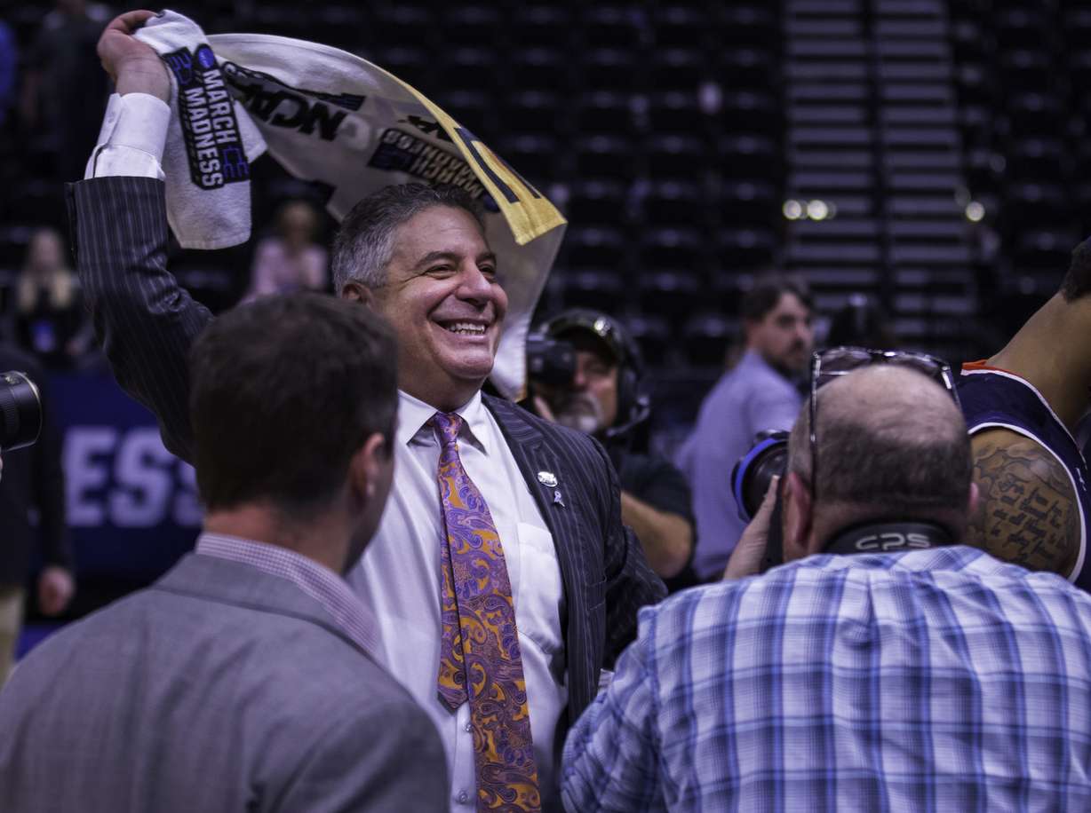 Auburn head coach Bruce Pearl waves a towel in celebration as he walks off the court at Vivint Arena following Auburn's 89-75 win over Kansas in the second round of the NCAA tournament on Saturday, March 23, 2019. (Photo: Carter Williams, KSL.com)