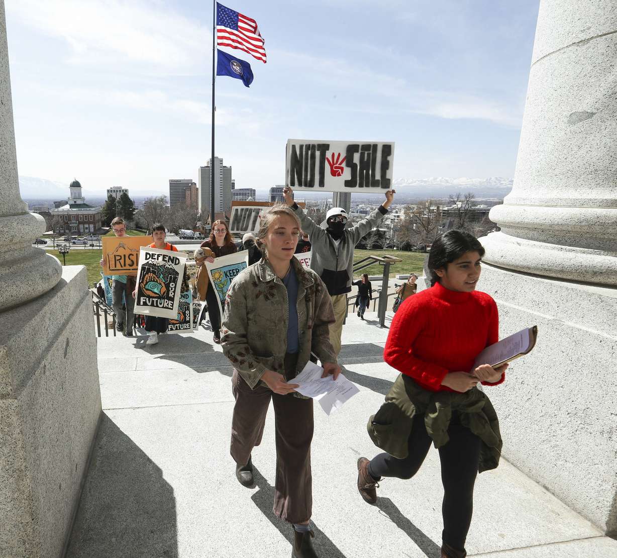 Eliza Van Dyk, a student at Westminster College, left, and Mishka Banuri, a senior at West High School, lead a rally up the Capitol steps on their way to deliver a letter with over 1,000 signatures to Gov. Gary Herbert's office in Salt Lake City on Monday, March 25, 2019. The letter urges the governor to oppose the BLM's oil and gas lease auction this week of lands near Bears Ears, Hovenweep and Canyons of the Ancients national monuments as well as other areas in the state. (Photo: Steve Griffin, KSL)
