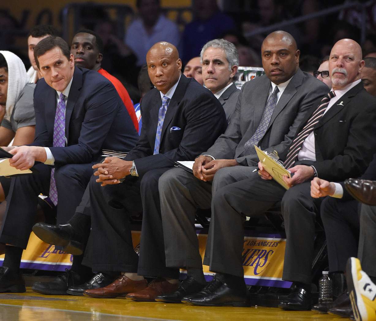 Los Angeles Lakers assistant coach Mark Madsen, left, sits next to head coach Byron Scott, second from left, assistant coach Paul Pressey and trainer Gary Vitti during the second half of an NBA basketball game against the Chicago Bulls, Thursday, Jan. 28, 2016, in Los Angeles. (Photo: Mark J. Terrill, AP)
