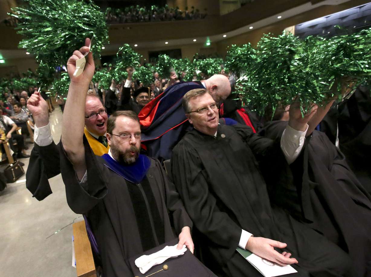 Craig Thulin, Utah Valley University Faculty Senate president, and other attendees wave pompoms and cheer for Astrid S. Tuminez, UVU’s seventh president, during her inauguration ceremony at the UVU Noorda Center for the Performing Arts in Orem on Wednesday, March 27, 2019. (Photo: Kristin Murphy, KSL)