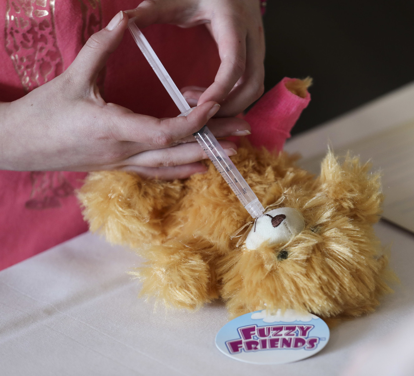 A teddy bear gets some medicine as hundreds of children attend the Teddy Bear Clinic and Picnic at McKay-Dee Hospital in Ogden on Wednesday, March 27, 2019. Children were given teddy bears and then went to a doctor's visit for the toys. The Teddy Bear Clinic is meant to help teach the importance of health to kids. Photo: Steve Griffin, KSL