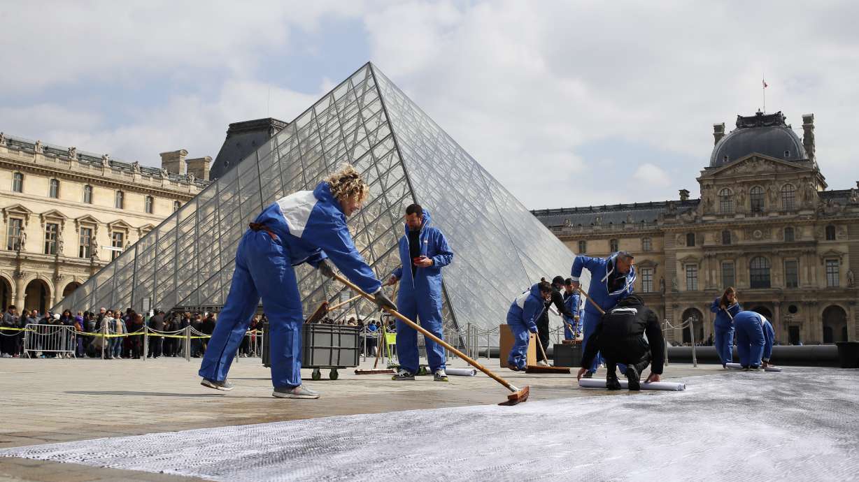 Amid gripes, Louvre pyramid celebrates 30 years with collage