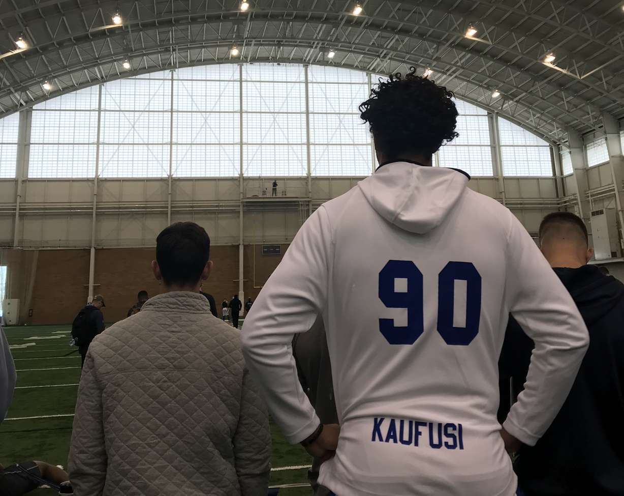 Former BYU defensive end Corbin Kaufusi watches his ex-teammates work out in front of NFL scouts, Friday, March 29, 2019 in BYU's indoor practice facility in Provo, Utah. (Photo: Sean Walker, KSL.com)