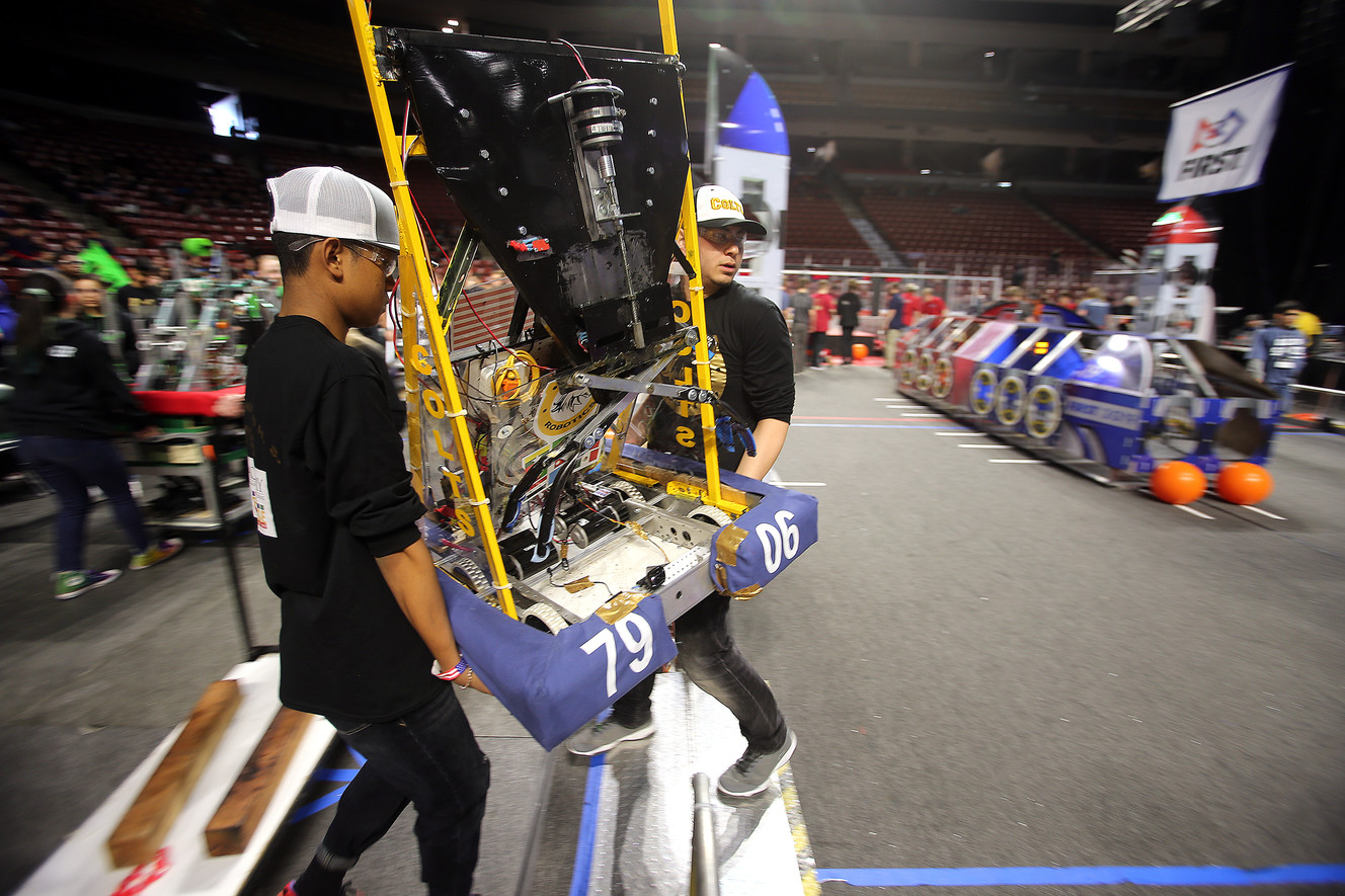 Aye Chan and Abdul Ayubi carry the robot into the arena as they and other students from Cottonwood High School compete in the First Robotics Competition Utah Regional event at the Maverik Center in West Valley City, Utah, on Friday, March 29, 2019. (Photo: Scott G Winterton, KSL)