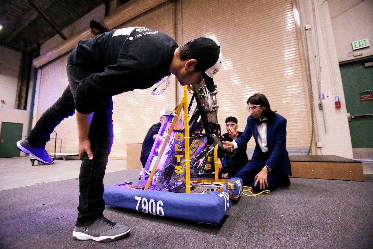 Abdul Ayubi takes a look in front at the robot during practice as students from Cottonwood High School work to compete in the First Robotics Competition Utah Regional event at the Maverik Center in West Valley City, Utah, on Friday, March 29, 2019. (Photo: Scott G Winterton, KSL)