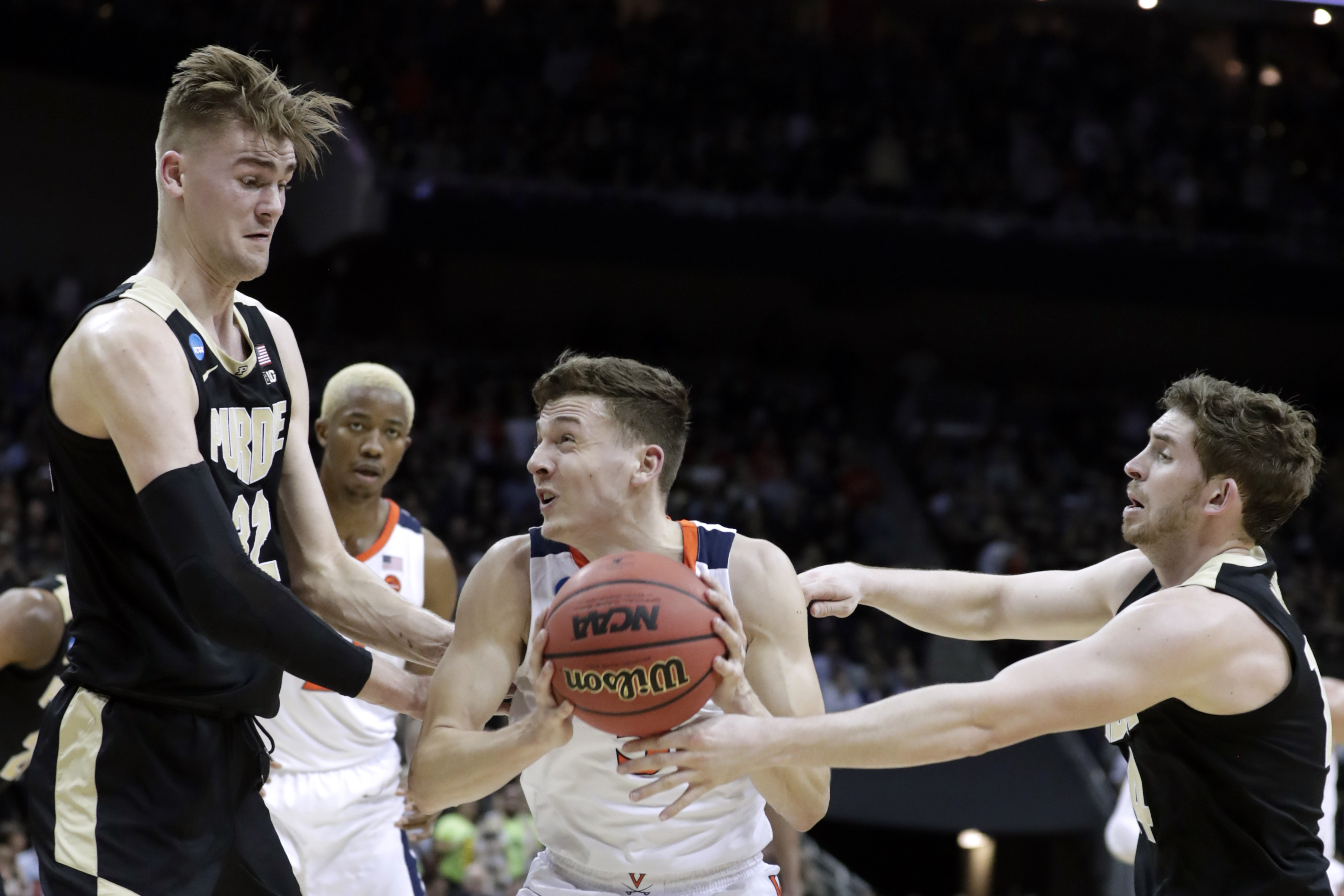 Virginia shakes off Purdue 80-75 in OT to win South Region