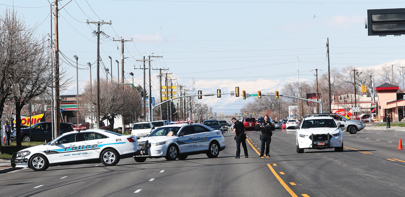 Officers stop southbound traffic as West Valley police and firefighters respond to a fatal rollover on Redwood Road near 3692 South on Sunday, March 31, 2019. A 76-year-old Sandy man was killed in the crash. (Photo: Scott G Winterton, KSL)