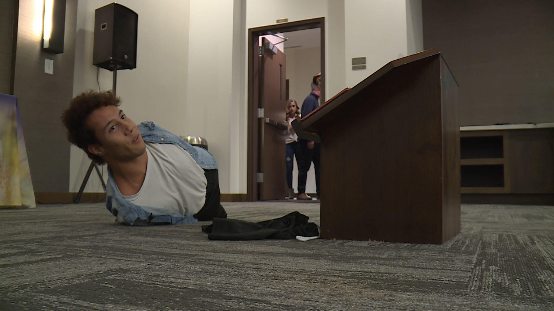 Gabe Adams began a recent motivational speech by going across the stage and then falling down. He then proceeded to show the crowd he could easily get back up, despite his lack of arms and legs. The Layton man has Hanhart syndrome and was born without limbs, but he doesn't let anything slow him down. (Photo: Adam Sotelo, KSL TV)