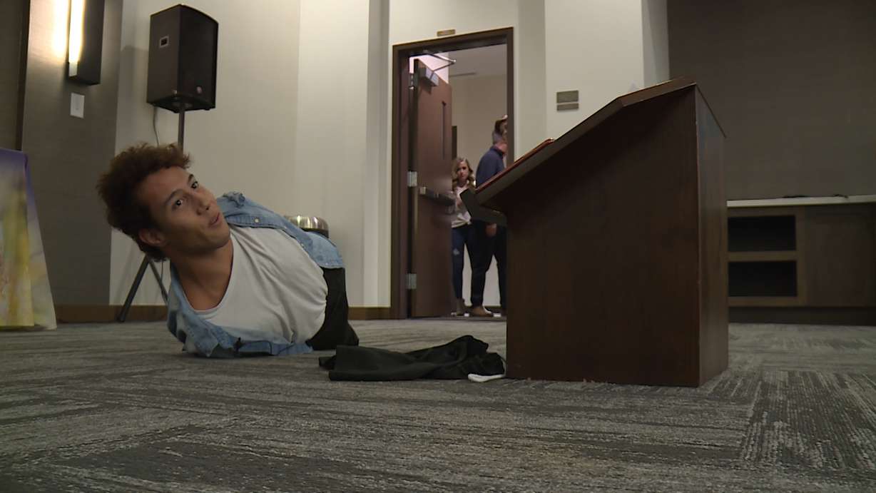 Gabe Adams began a recent motivational speech by going across the stage and then falling down. He then proceeded to show the crowd he could easily get back up, despite his lack of arms and legs. The Layton man has Hanhart syndrome and was born without limbs, but he doesn't let anything slow him down. (Photo: Adam Sotelo, KSL TV)