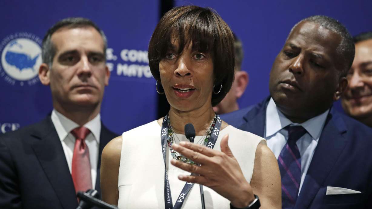 Baltimore mayor goes on leave as book scandal intensifies