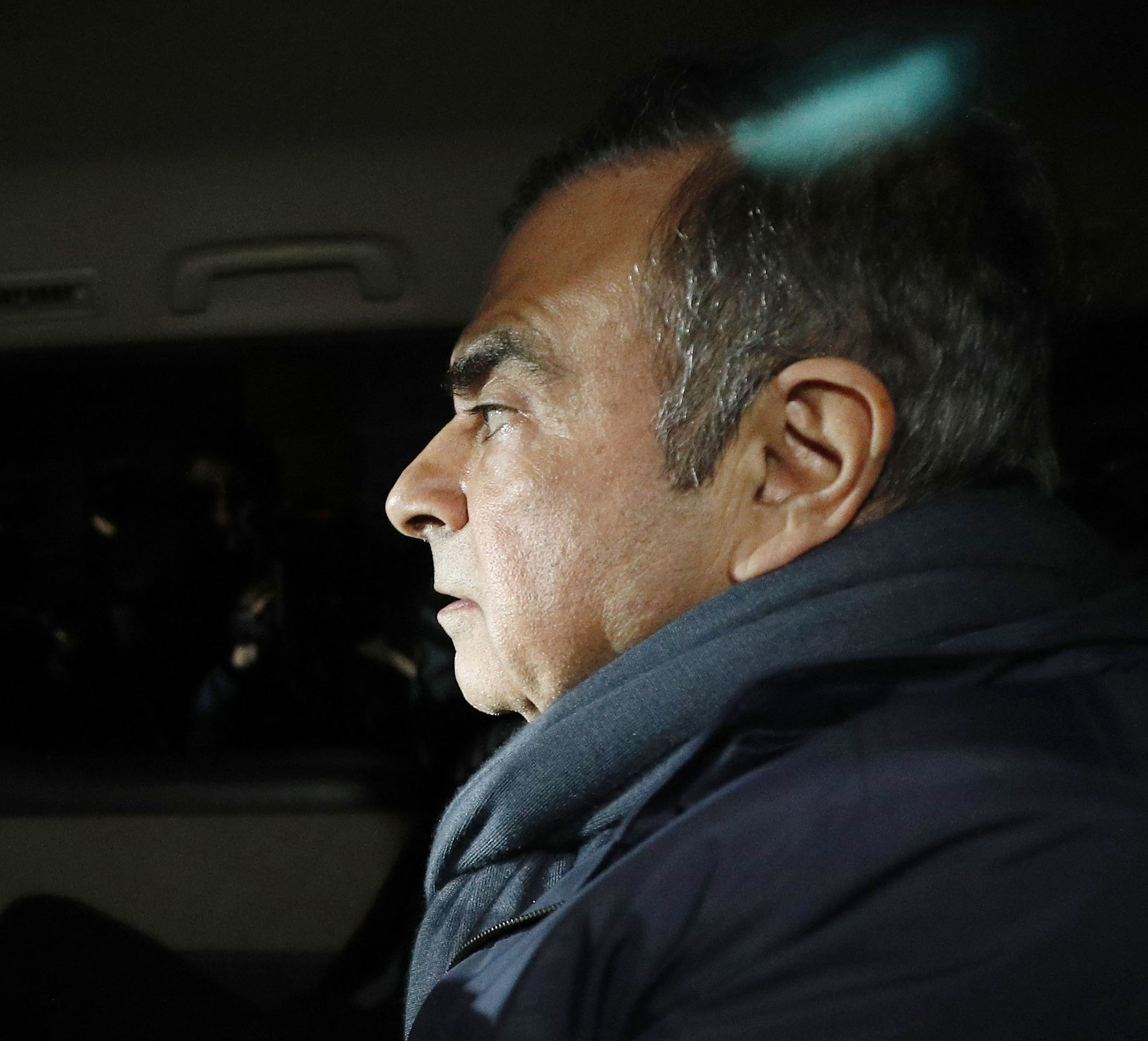 The Latest: Ghosn predicted arrest in French TV interview