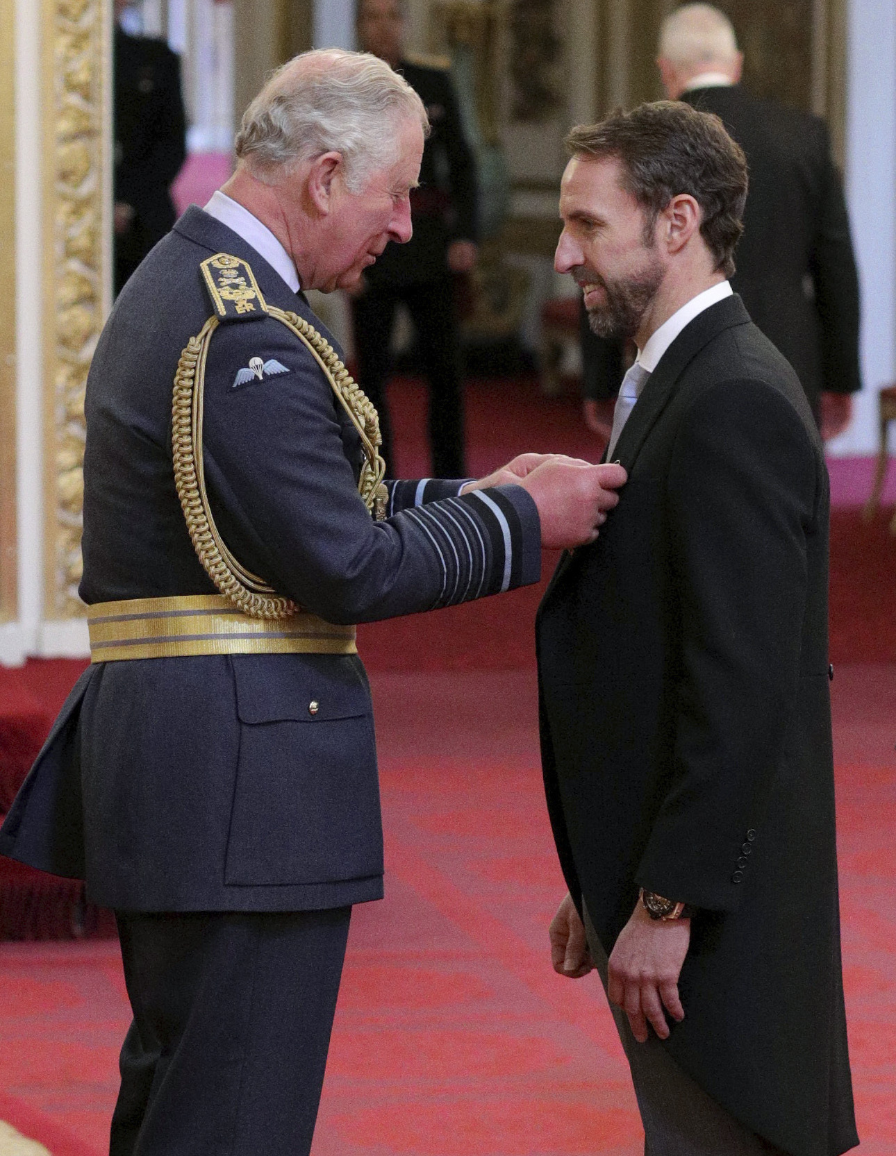 Back in his vest, Southgate gets honor at Buckingham Palace