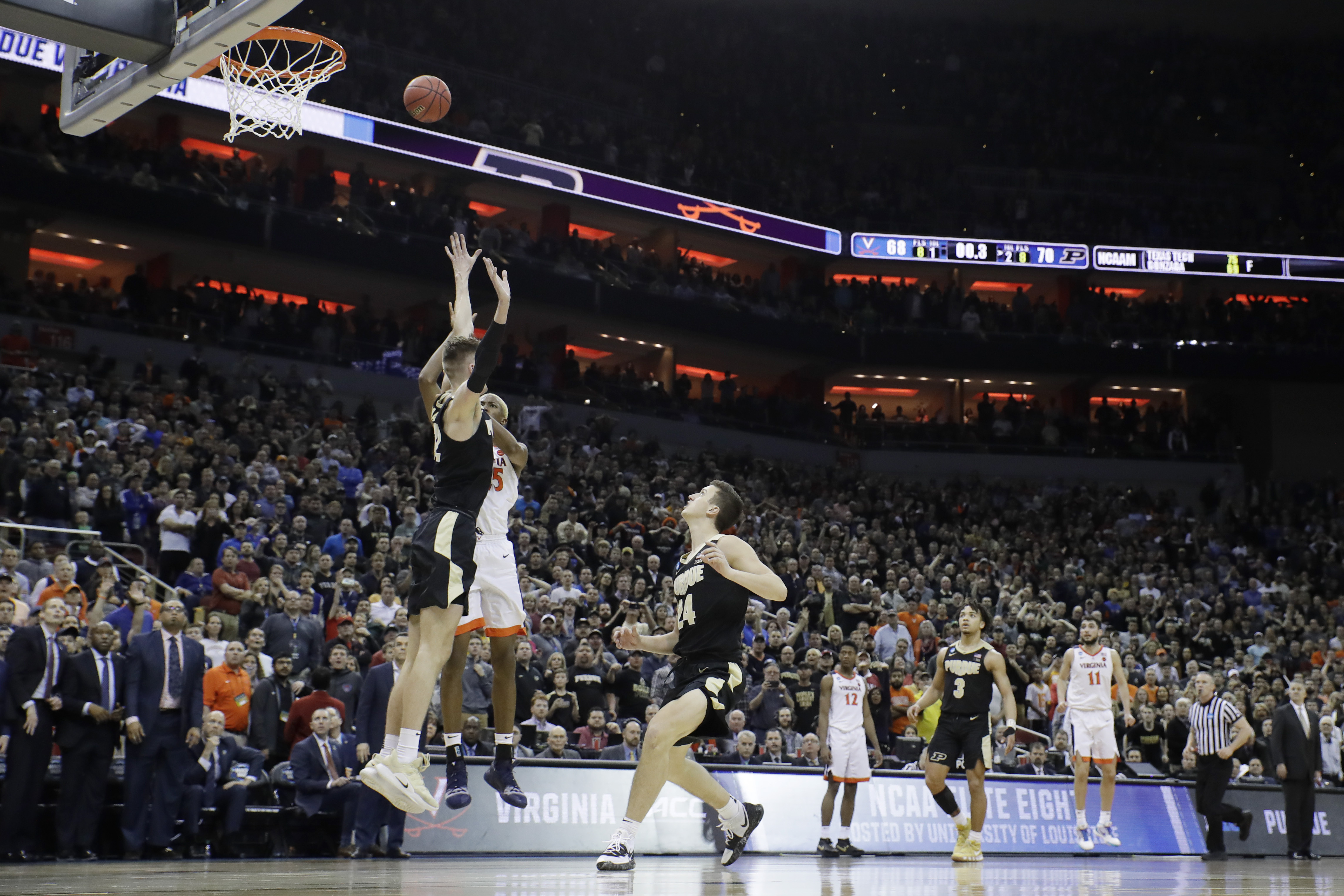 Virginia's Mamadi Diakite (25) shoots over Purdue's Matt Haarms (32) at the buzzer to end the second half of the men's NCAA Tournament college basketball South Regional final game, Saturday, March 30, 2019, in Louisville, Ky. (Photo: Timothy D. Easley, AP Photo)