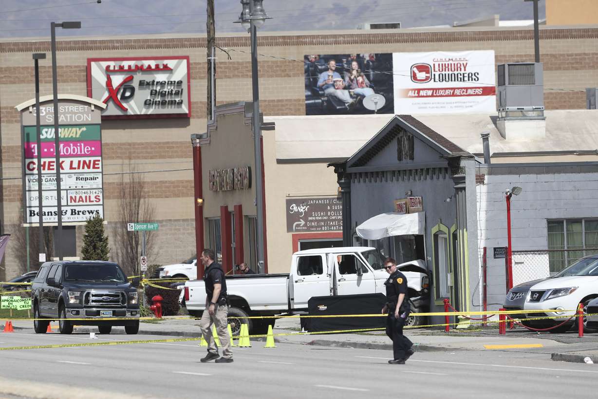 A white pickup truck that crashed into Princess Alterations, 3339 S. State, in South Salt Lake is pictured on Monday April 8, 2019. The driver of the pickup, who was suspected of committing two robberies and who apparently opened fire outside the Sheraton Hotel in downtown Salt Lake City earlier Monday, died after leading police on a chase that ended in a crash and a hail of bullets. (Photo: Steve Griffin, KSL)