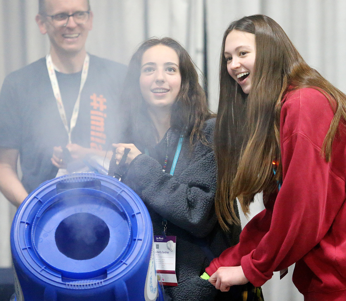 Liberty Gardner and Lauren Dragas shoot smoke circles into the air during SheTech Explorer Day at the a Mountain America Exposition Center in Sandy on Tuesday, April 9, 2019. Photo: Scott G Winterton, KSL