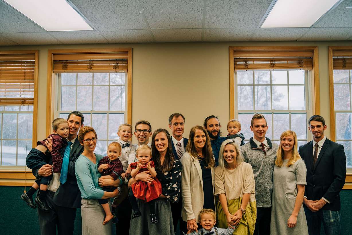 Providence, Cache County, resident Chris Checketts, center, and his family. Checketts was a champion snowmobiler who ddied Saturday, April 6, 2019, two days after he was injured in a snowmobile accident. (Photo: Family photo)